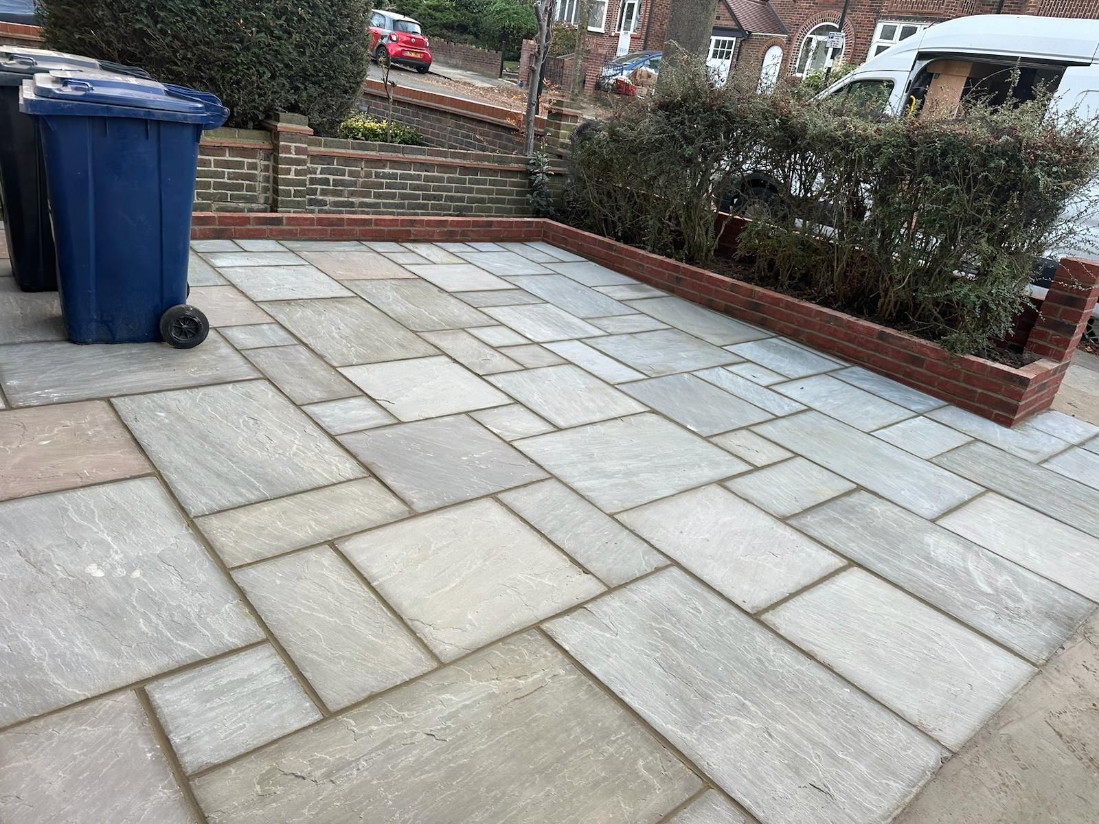 Brick retaining wall and sandstone paving by Delta Construction